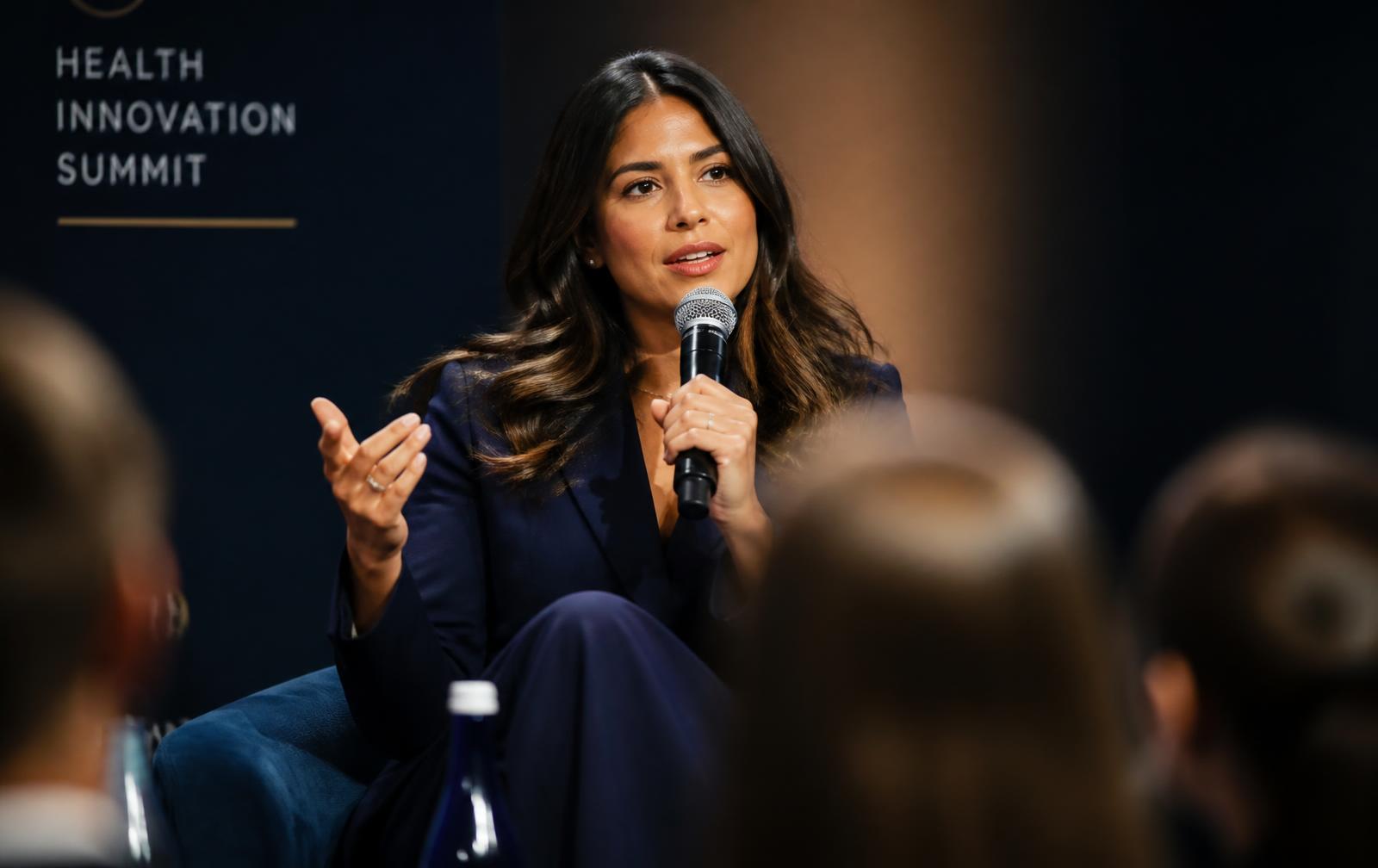 A physician speaking on a professional conference panel